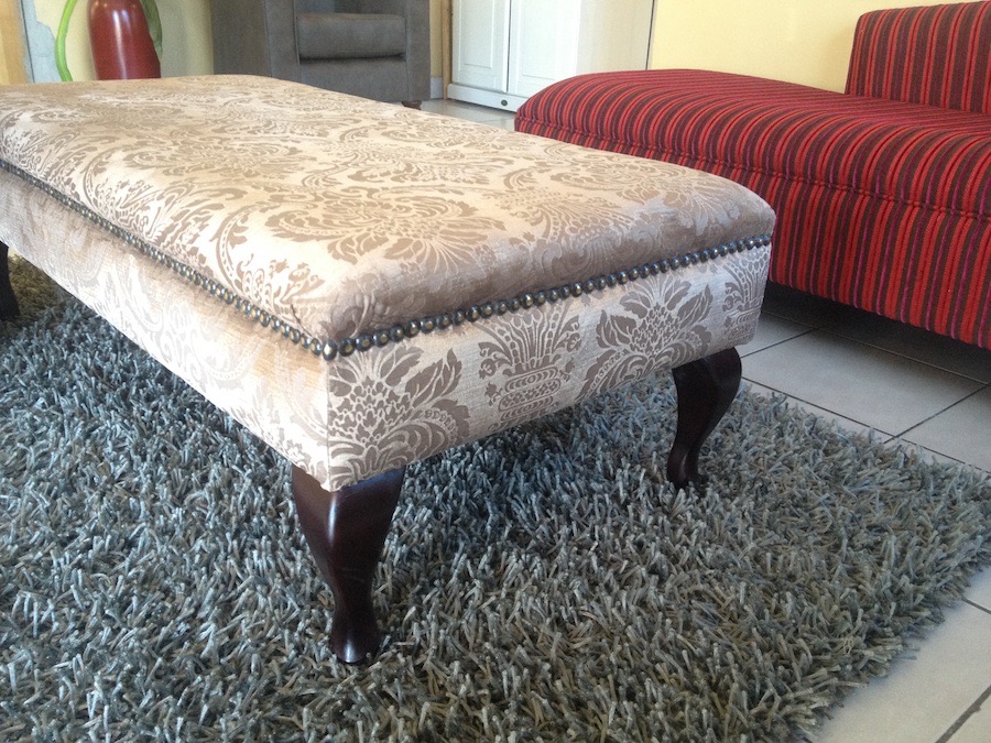 Ottoman upholstered in fabric from Hertex